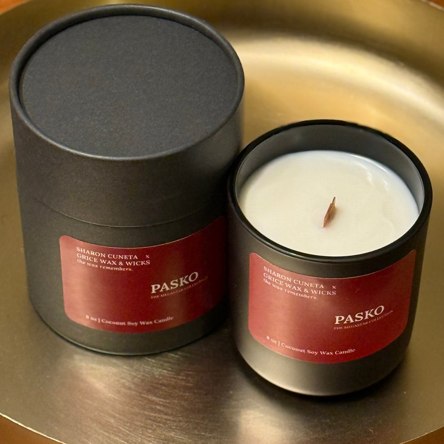 Pasko candle and packaging on a metallic surface