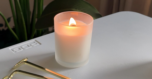 Lit coconut soy candle from Grice Wax & Wicks with the message ‘What You Burn Matters — Choose with Intention,’ inspiring mindful and intentional burning