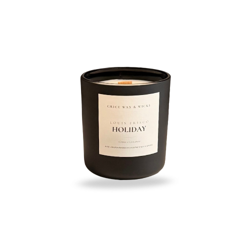 Black candle with ‘Holiday’ label on a white background — clean seasonal coconut soy scent with soft wooden wick crackle