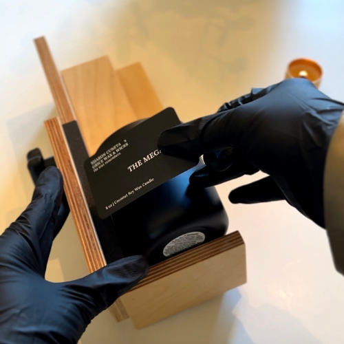 Grice adding the megastar label to the black jar. Sharon Cuneta x Grice Wax & Wicks Collaboration.