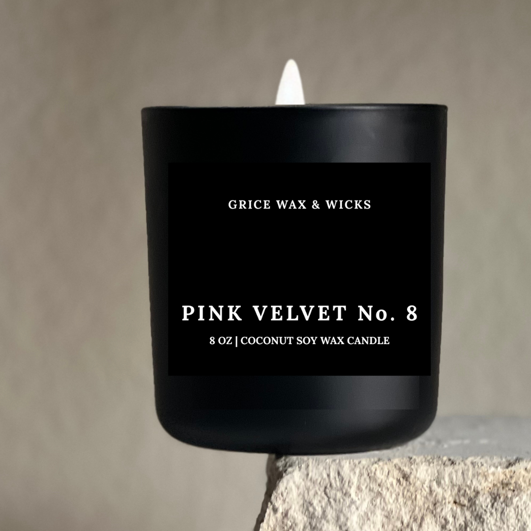 Black candle labeled 'Grice Wax & Wicks Pink Velvet No. 8' on a neutral background