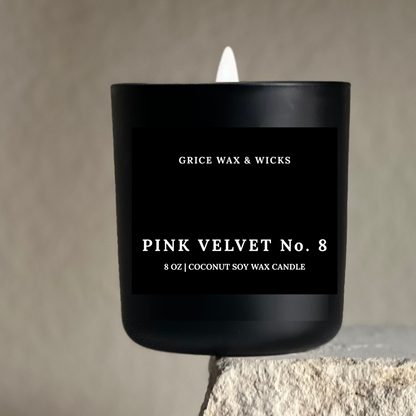 Black candle labeled 'Grice Wax & Wicks Pink Velvet No. 8' on a neutral background
