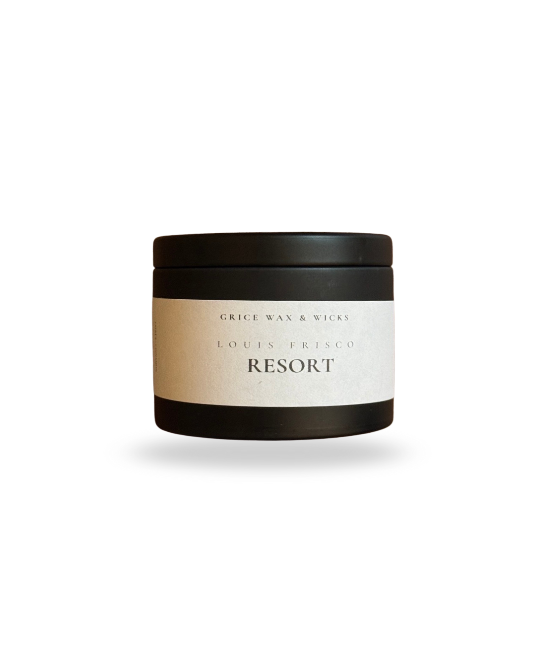 4 oz black tin candle labeled “Resort” by Grice Wax & Wicks, spa clean home fragrance.