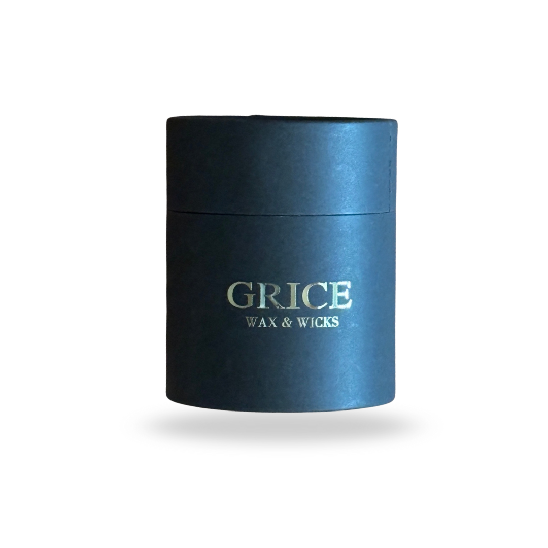 black cylindrical container with 'Grice Wax & Wicks' branding on a white background