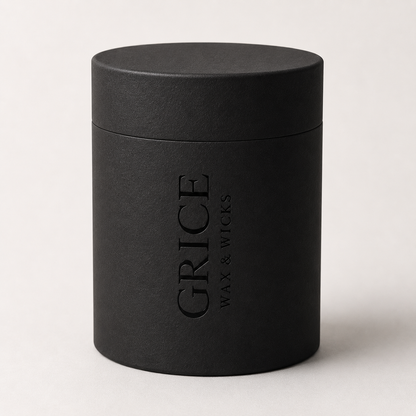 Black cylindrical container with 'Grice Wax & Wicks' branding on a light background