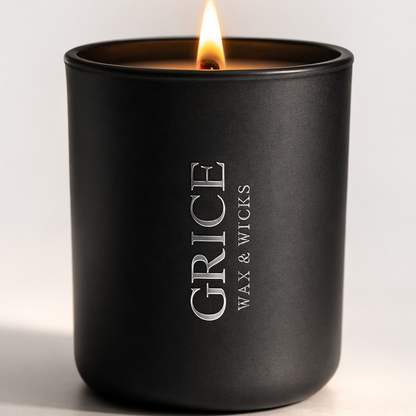 Black candle with 'Grice Wax & Wicks' branding on a white background