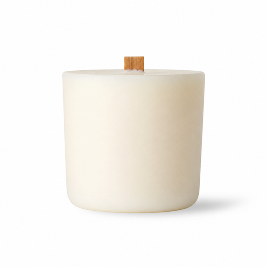 White candle with a wooden wick on a white background