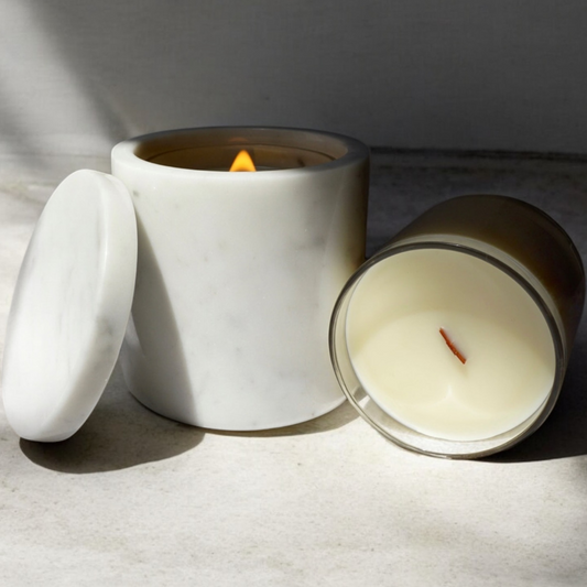 White ceramic candle with lid on a light surface