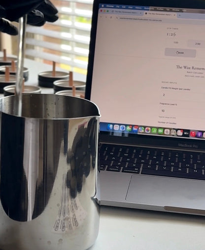 Metal pitcher with a blurred laptop displaying the wax remembers batch calculator by Grice wax & wicks