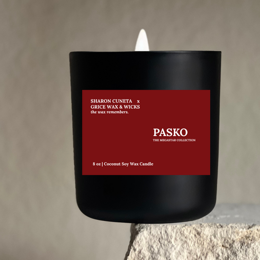 Luxury holiday candle PASKO from The Megastar Collection, hand-poured in a black jar with a red label, coconut soy wax and wooden wick.