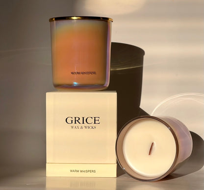Two candles and their packaging with 'Grice Wax & Wicks' branding on a neutral background.