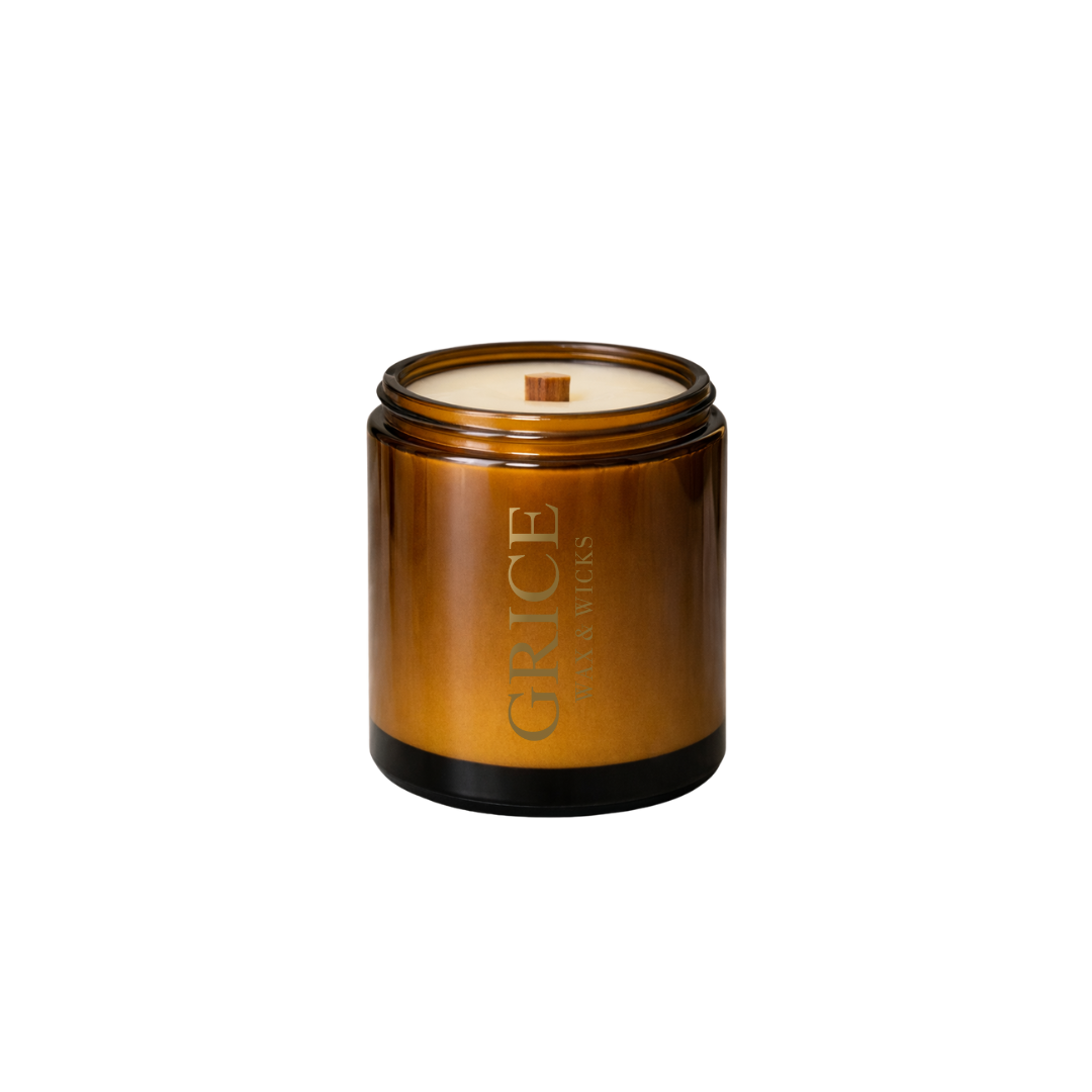 amber glass jar with a visible brand logo on a white background, by Grice Wax & wicks 2026