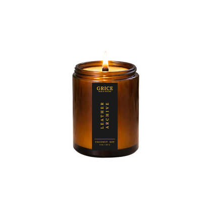 Amber candle with a black label on a white background