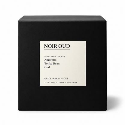 A black square candle box with a cream label reading 'NOIR OUD' and smaller text 'Amaretto Tonka Bean Oud' by Grice Wax & Wicks, shown on a white background.