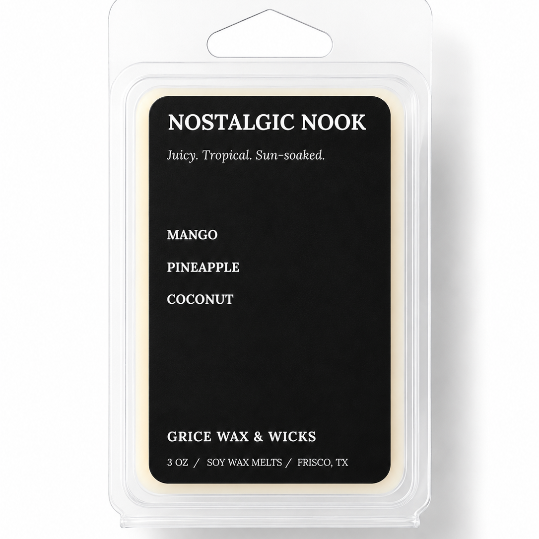 A packaged wax melt product in a clear plastic clamshell package with a black front label. The label reads 'NOSTALGIC NOOK' and lists flavors Mango, Pineapple, and Coconut, with 'GRICE WAX & WICKS' near the bottom.