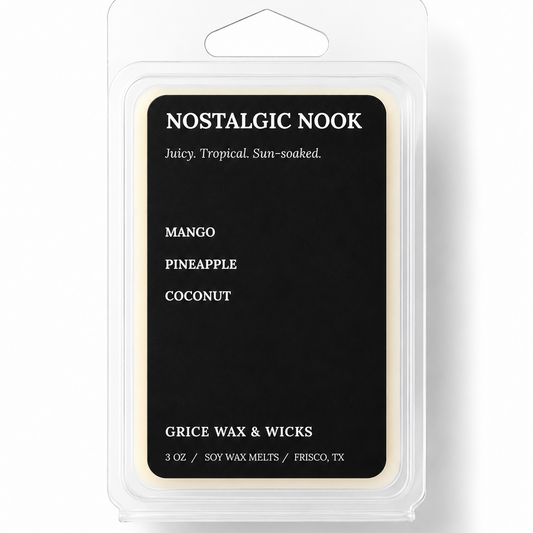 A packaged wax melt product in a clear plastic clamshell package with a black front label. The label reads 'NOSTALGIC NOOK' and lists flavors Mango, Pineapple, and Coconut, with 'GRICE WAX & WICKS' near the bottom.
