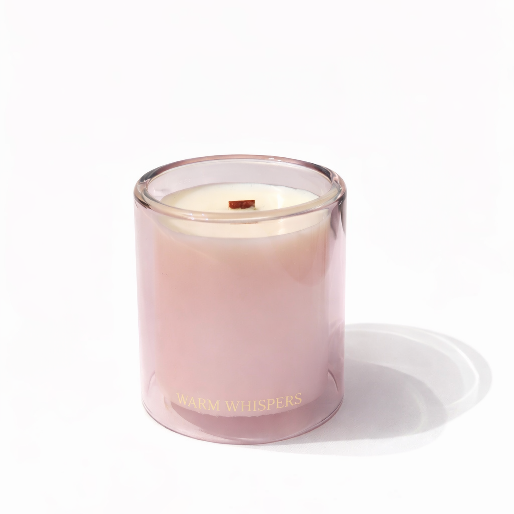 Pink candle with a visible brand name on a white background by Grice Wax & Wicks