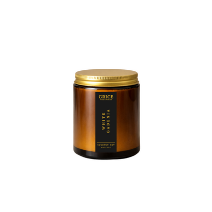 Brown candle jar with gold lid and black label on a white background by Grice Wax & Wicks 